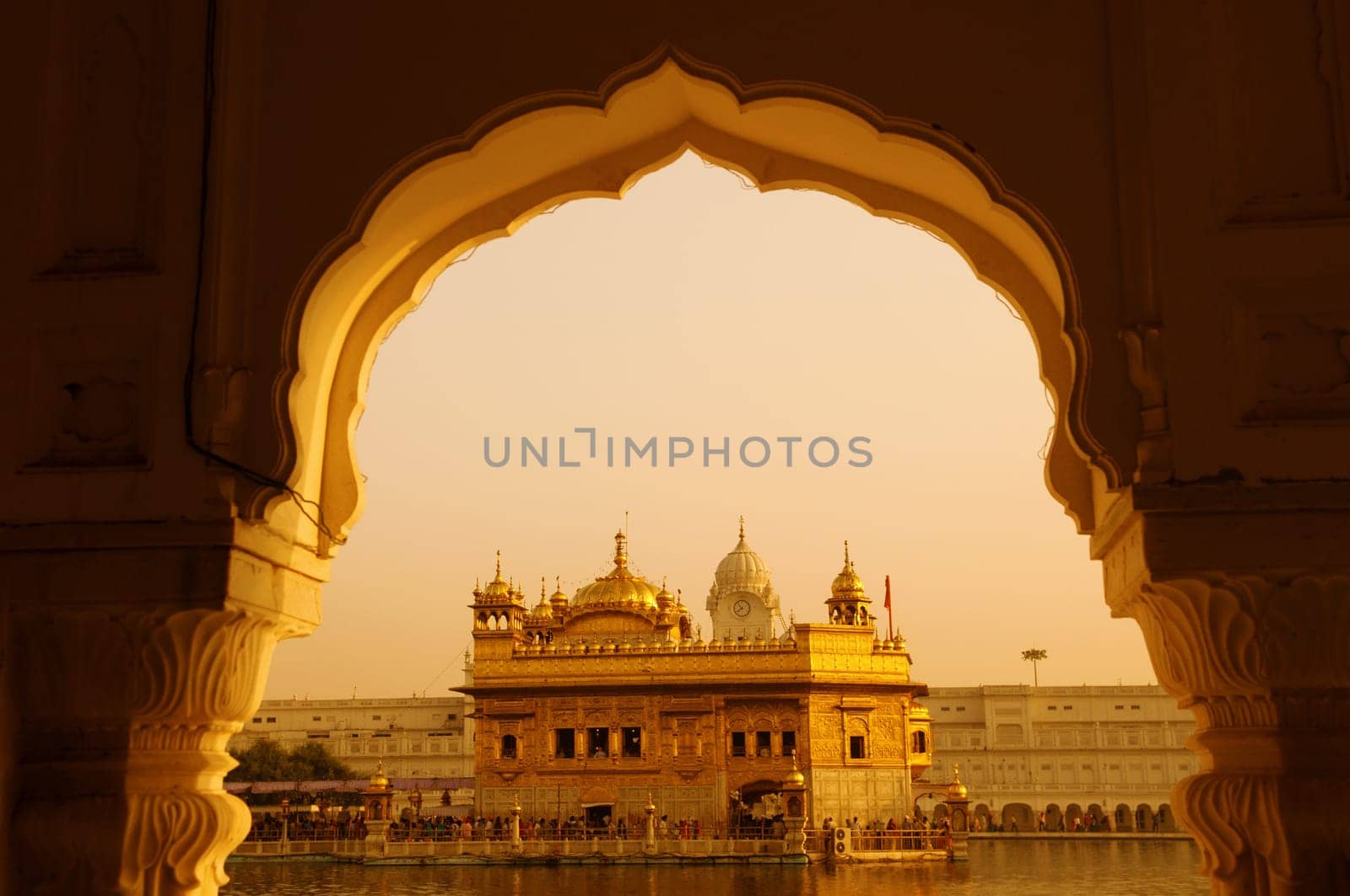 Amritsar Golden Temple - India. Framed with windows from west side. focus on temple