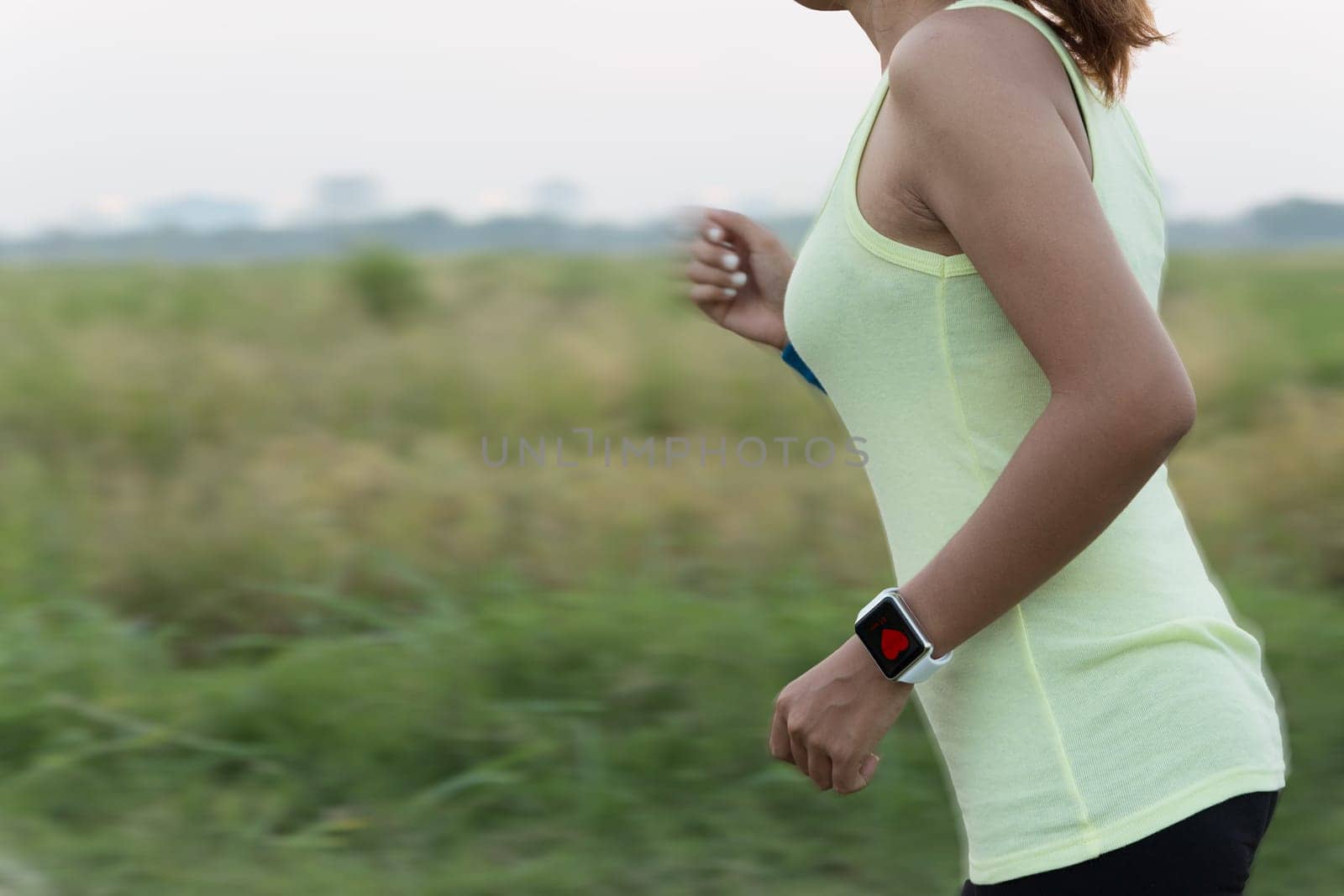 women wear smart hand watch running motion blur conceptt
