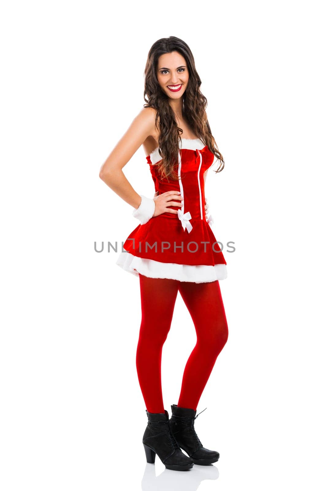 Beautiful and sexy woman wearing santa clause costume..