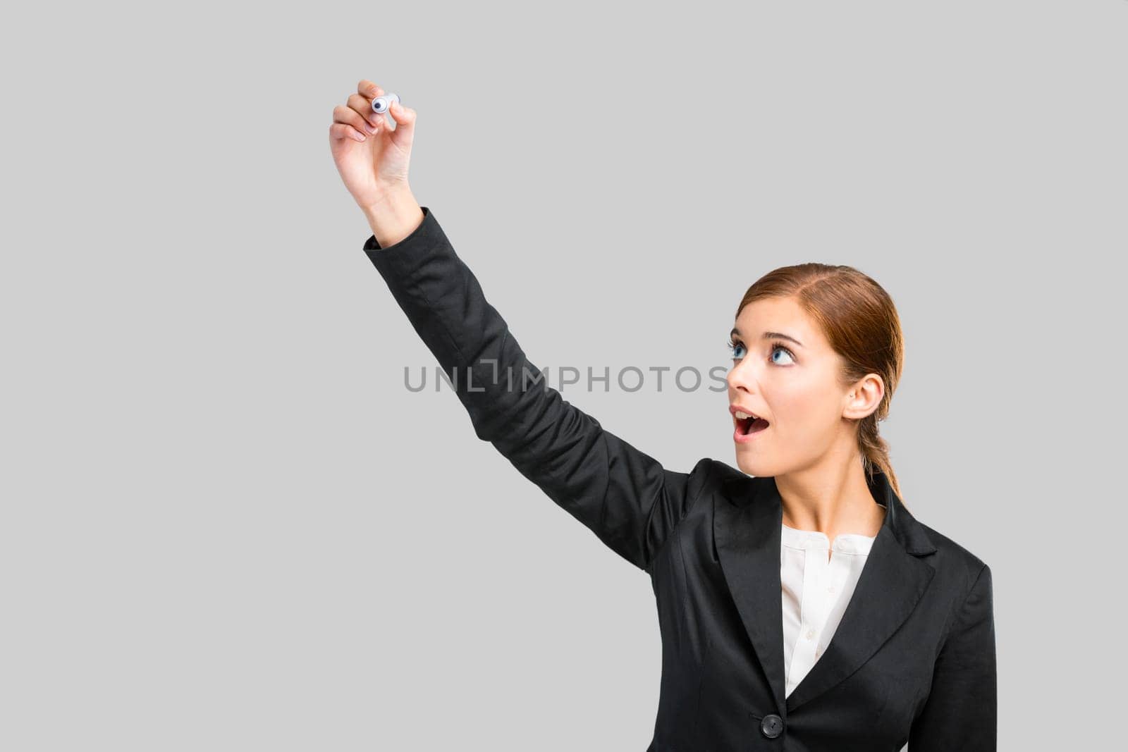 Beautiful businesswoman pointing