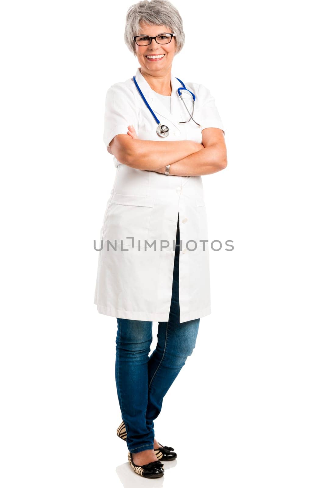 Happy old female doctor with hands folded, isolated on white