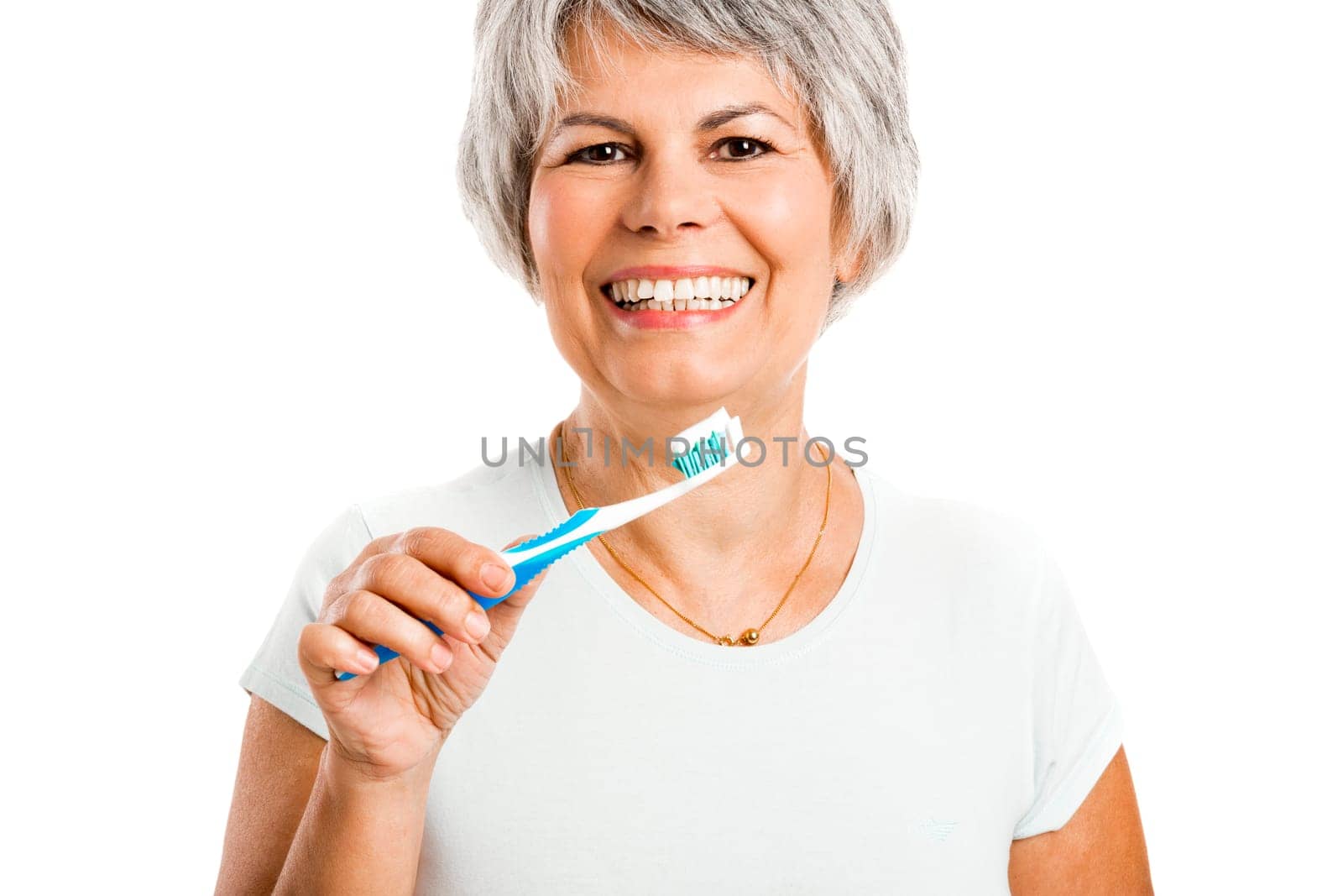 Portrait of a happy old woman brushing her teeth