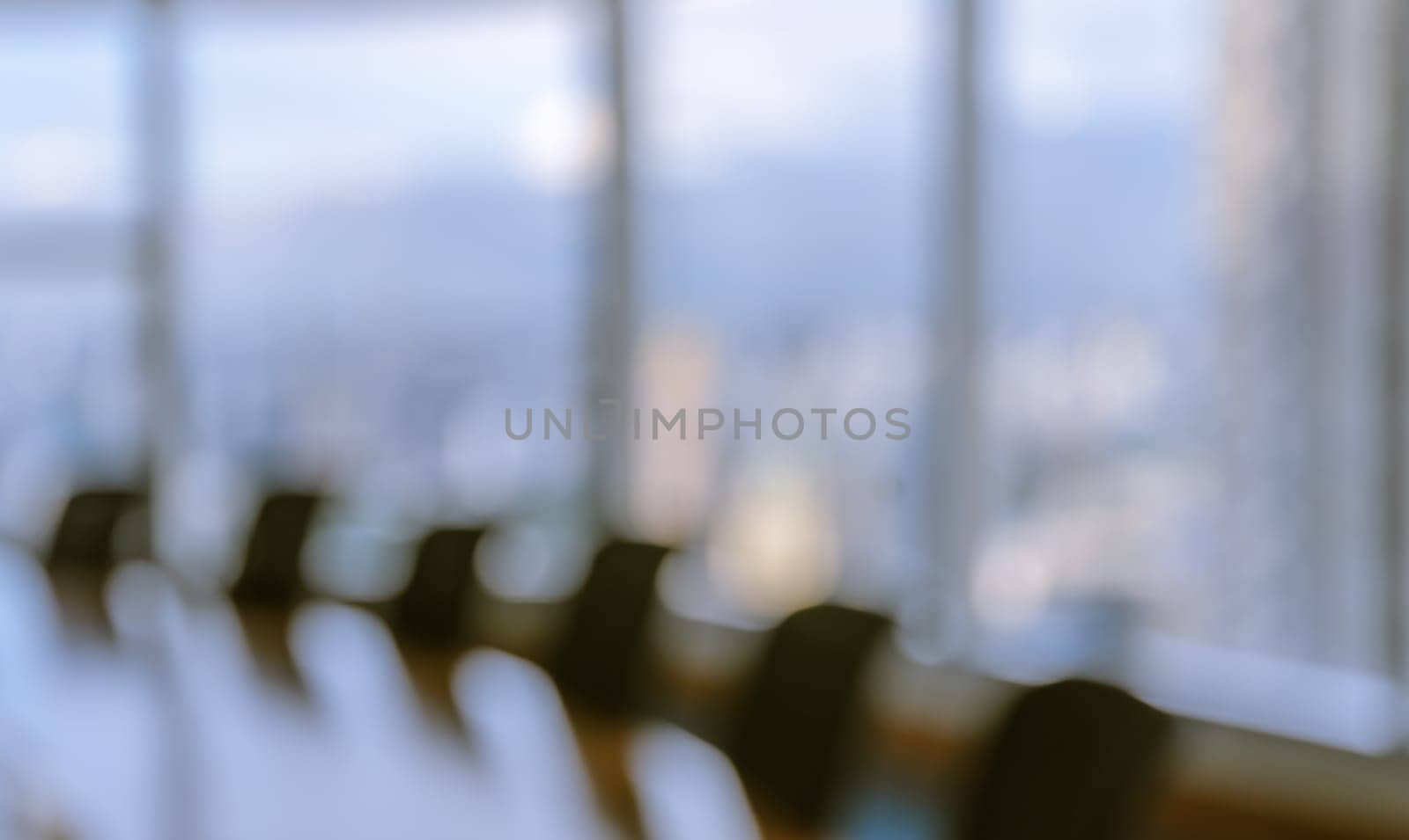 Blur image of empty boardroom with window cityscape background. Business concept