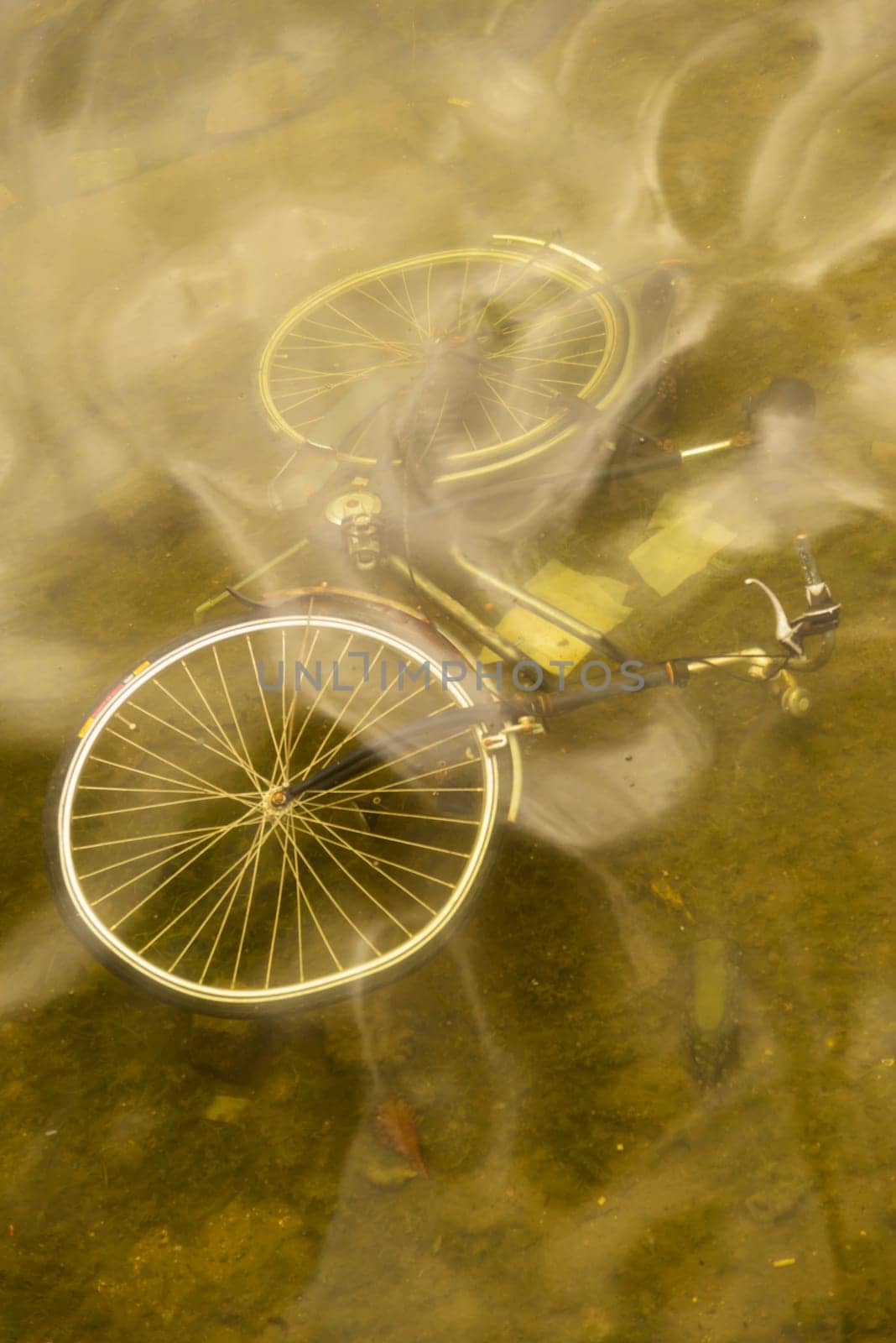 Abandoned bicycle on the bottom of a canal in the city of Copenhagen in Denmark.