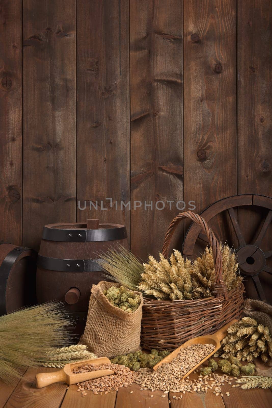 Old beer barrel with wheat,barley,hops and malt
