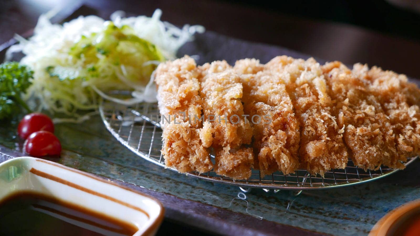 Fried pork with vegetable meal on the silver net