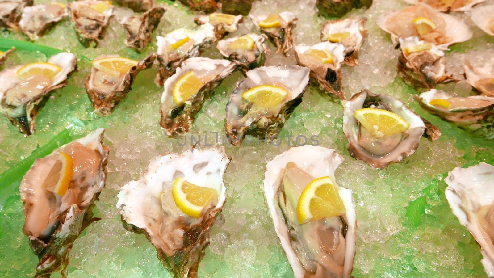 oysters on ice for sale at seafood market