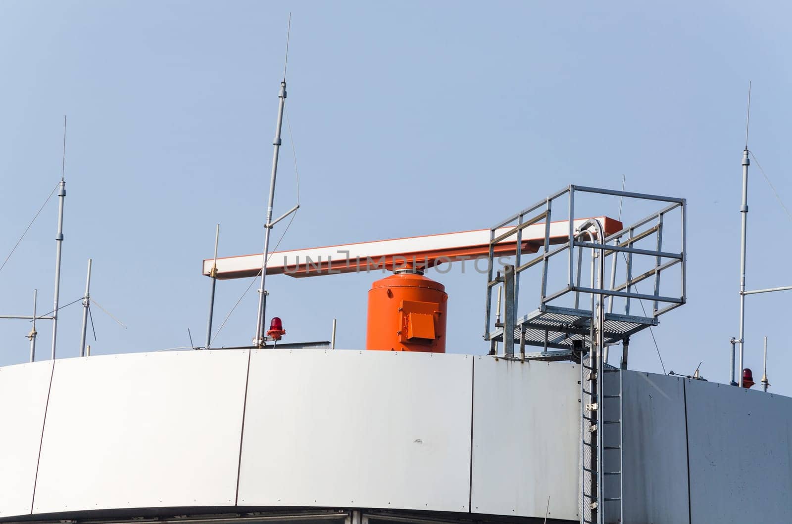Control tower at an international airport with radar on the roof..
