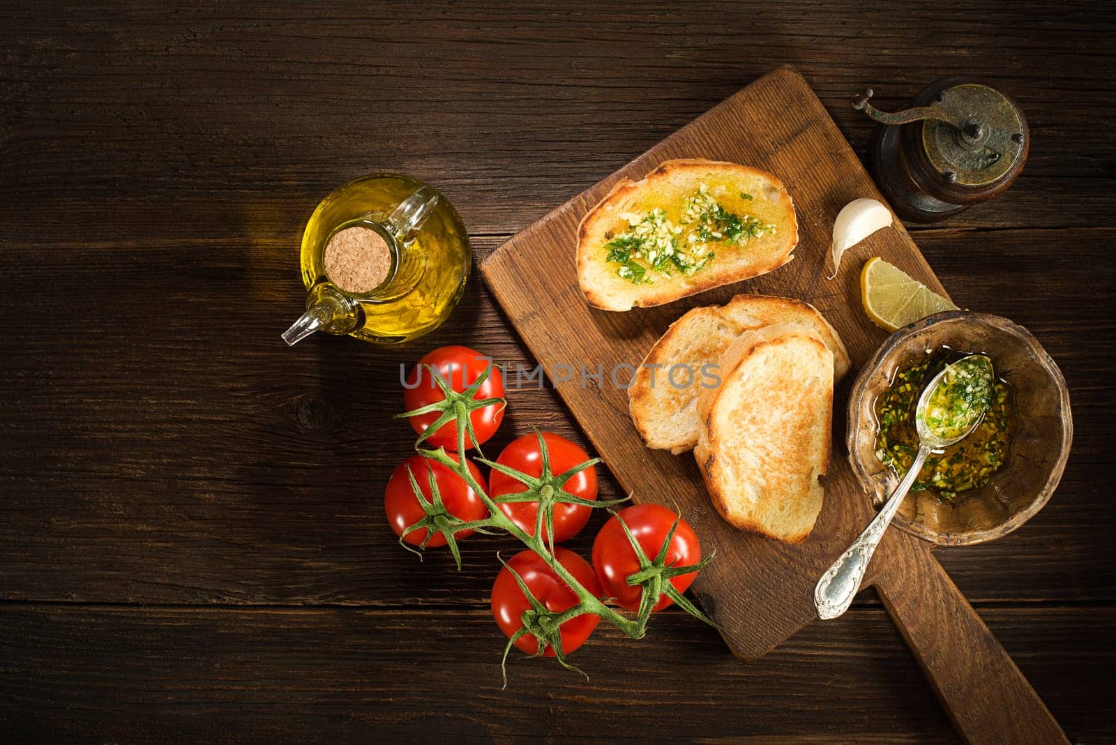 Appetizer Bruschetta with sauce of olive oil, garlic and herbs.