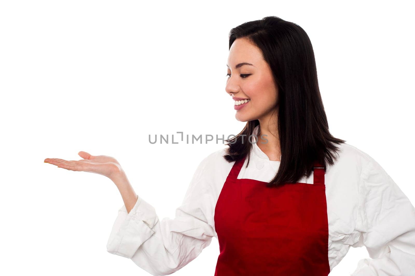 Young female chef presenting something