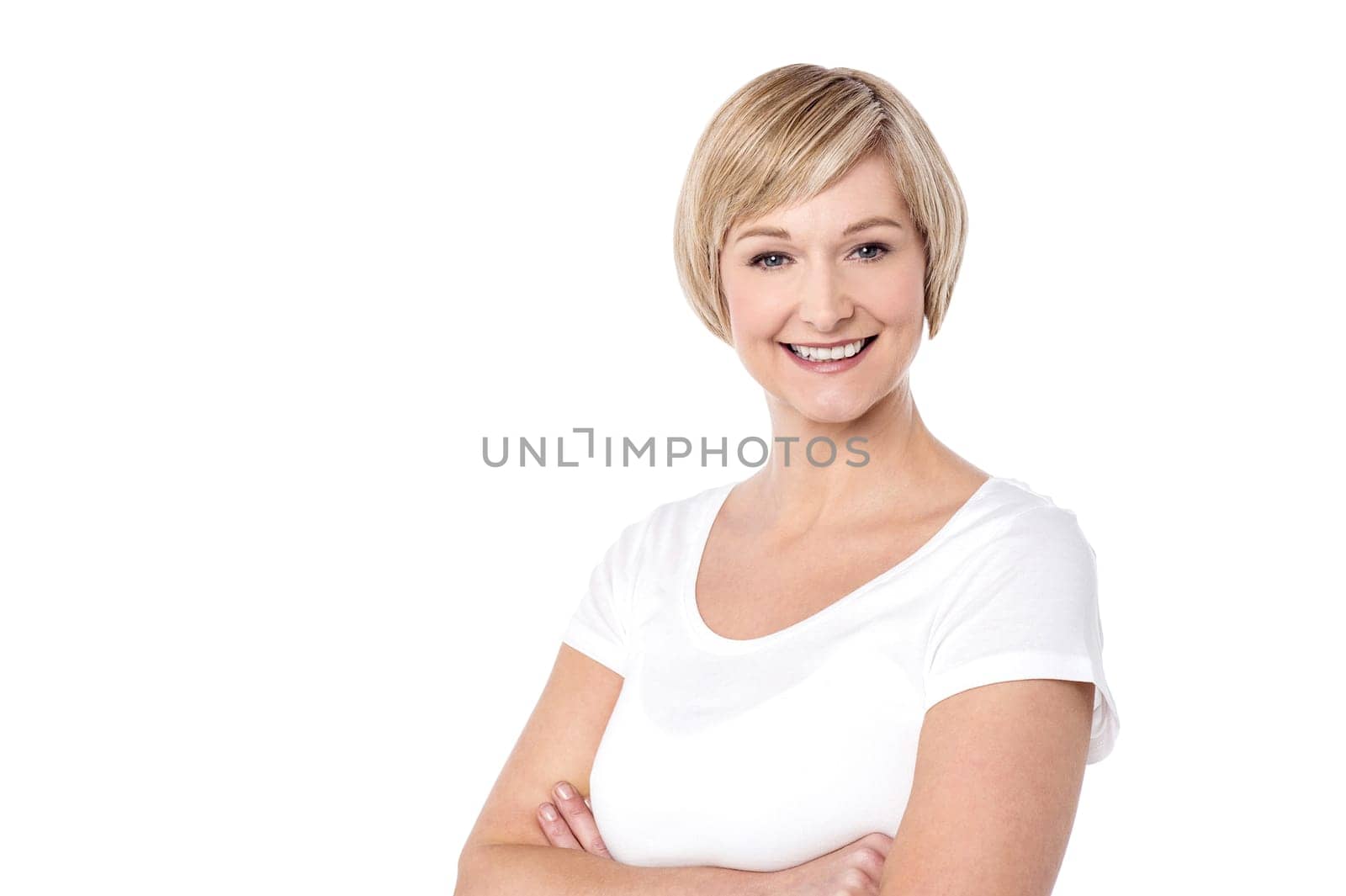 Happy middle aged woman with her arms crossed