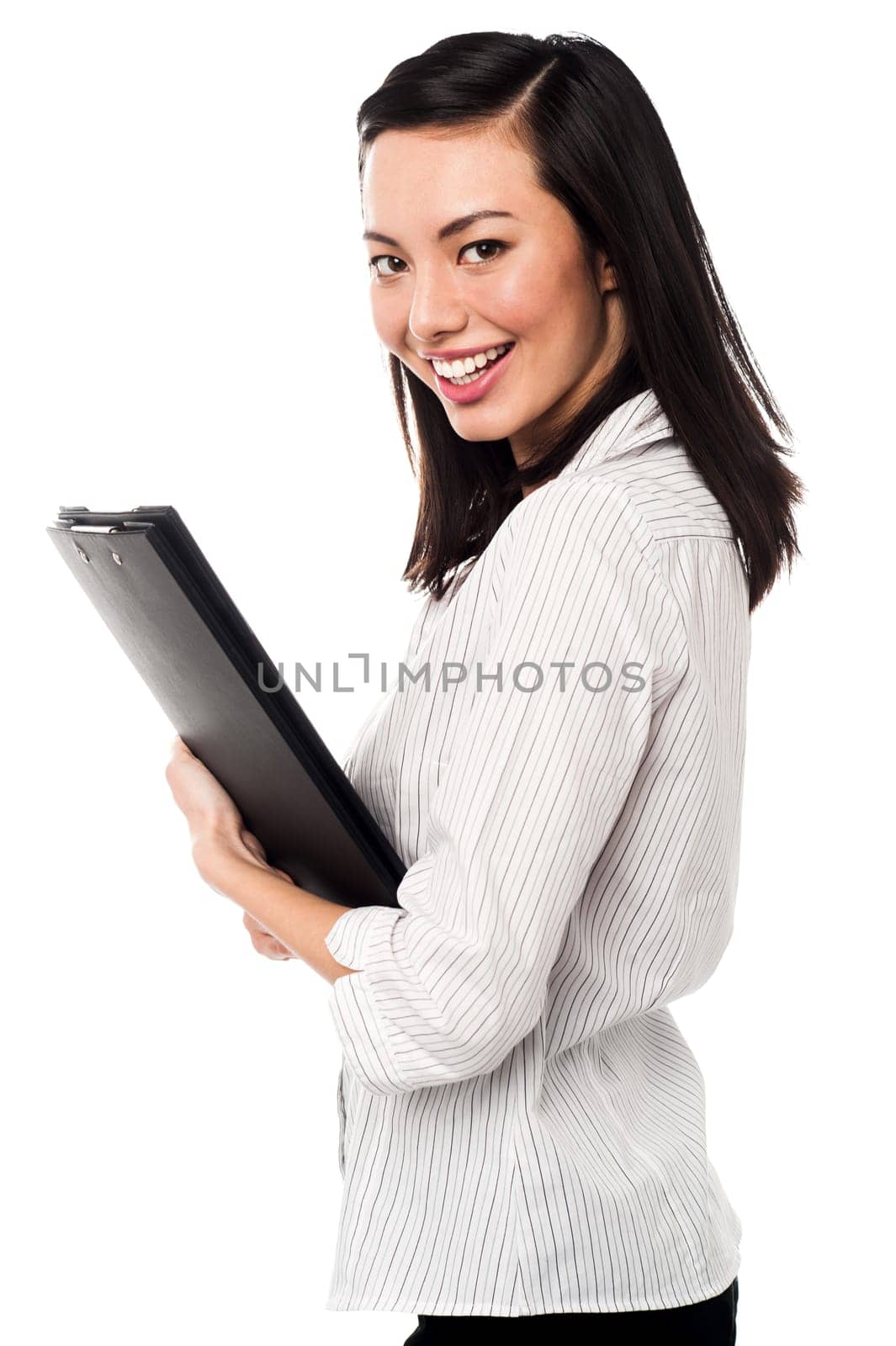 Smiling female executive holding file