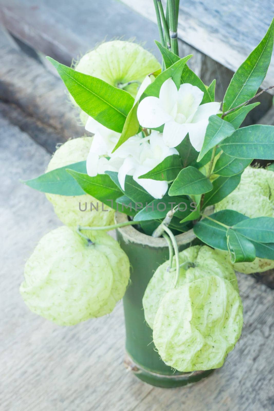 White flower decorated on wooden table, stock photo