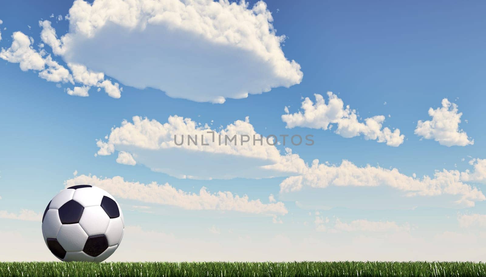 Soccer/football ball close up on grass lawn. Panoramic format. The ball stands on the left. Viewed from ground level, with white fluffy clouds sky in the background. Clipping path included.