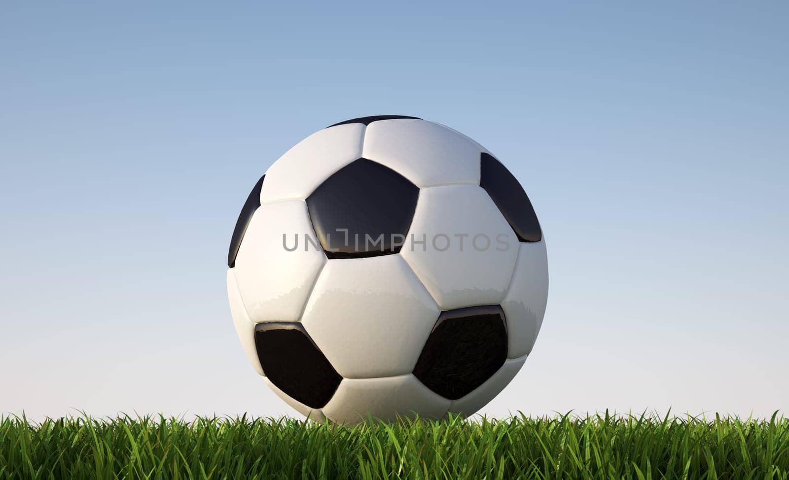 Soccer ball close up on grass lawn. Viewed from ground level. In sunny day light..With blue sky and no clouds as background. Clipping path included.