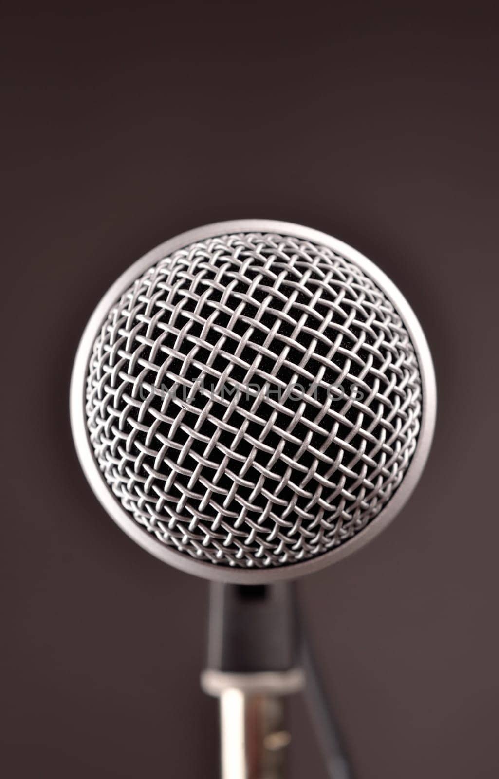 Modern microphone in a studio, close up with focus on foreground
