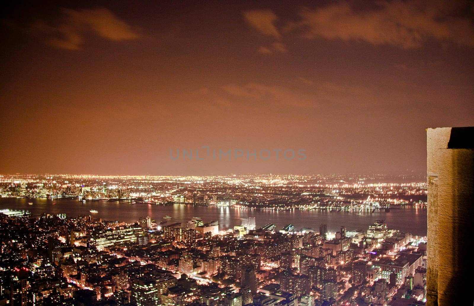 This is a partial view of a city's buildings and structures against the sky in New York from Empire State Building