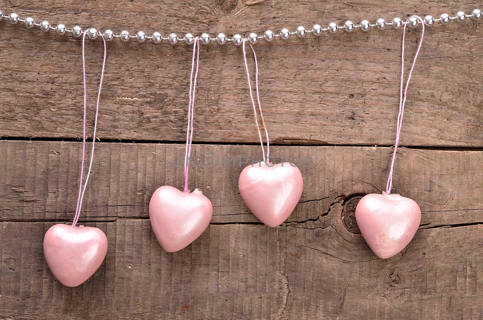 Vintage heart shapes on a rustic wooden background, love concept