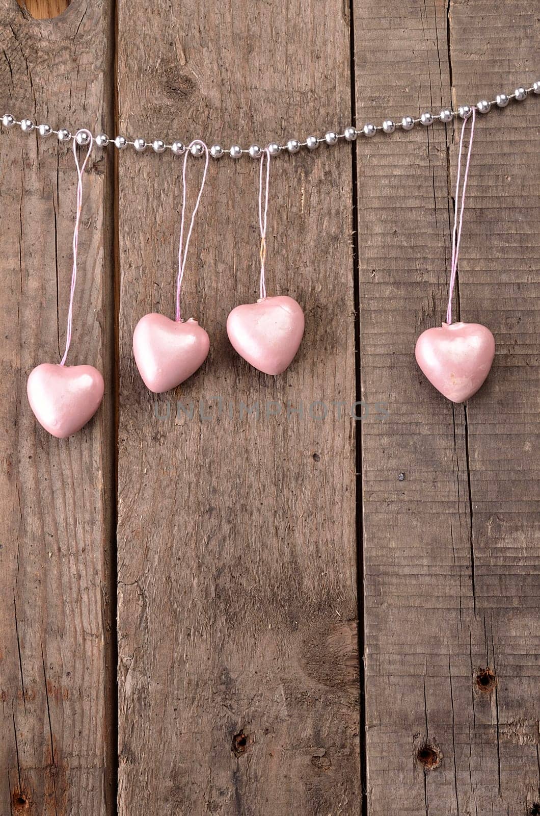 Vintage heart shapes on a rustic wooden background, love concept