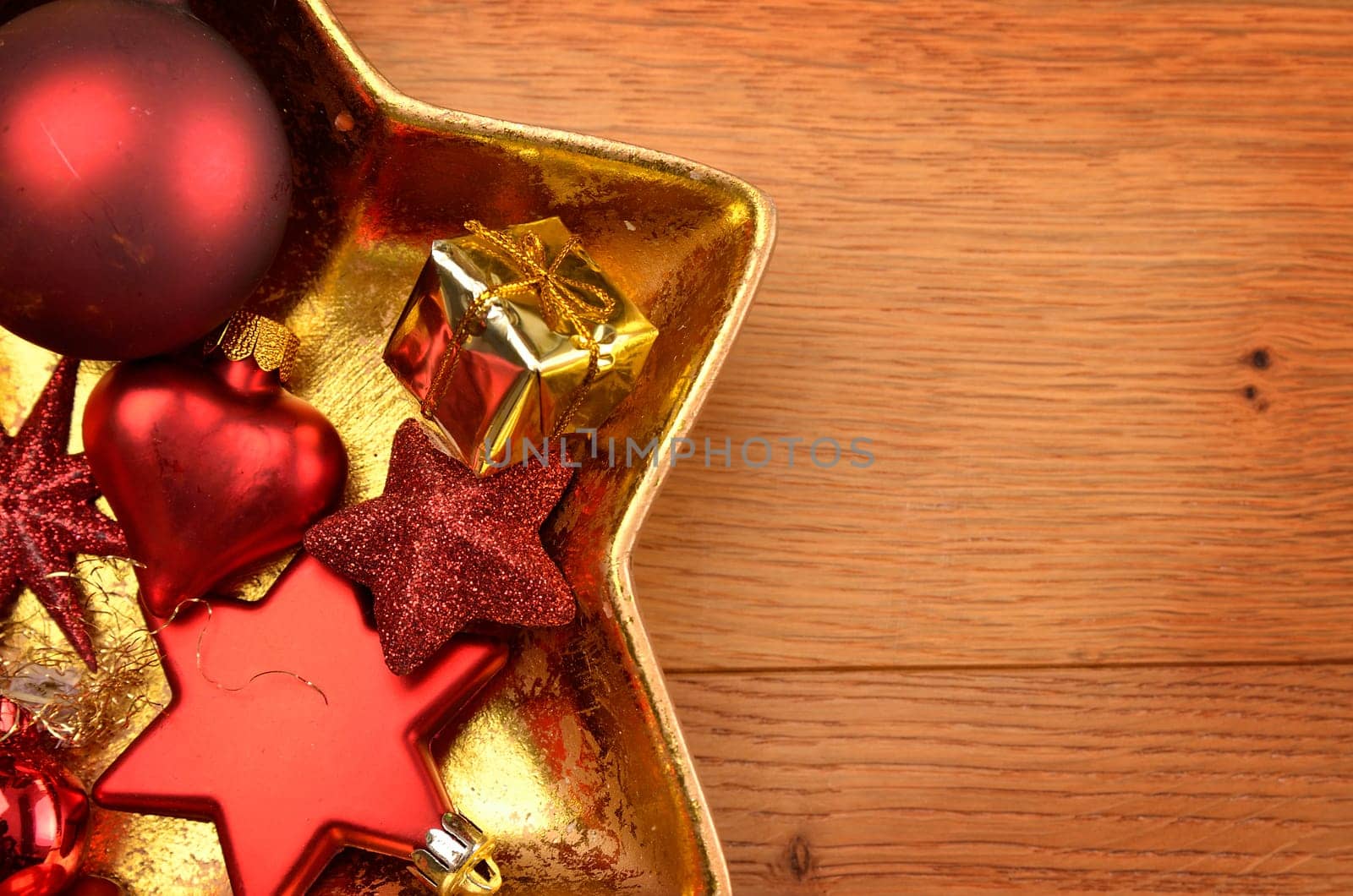 Christmas decoration in a star shaped bowl on a wooden table