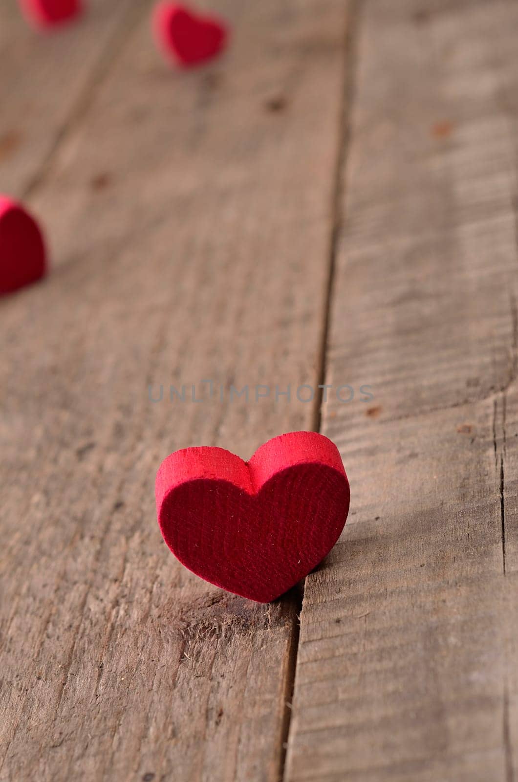 Red heart shape on a rustic wooden background