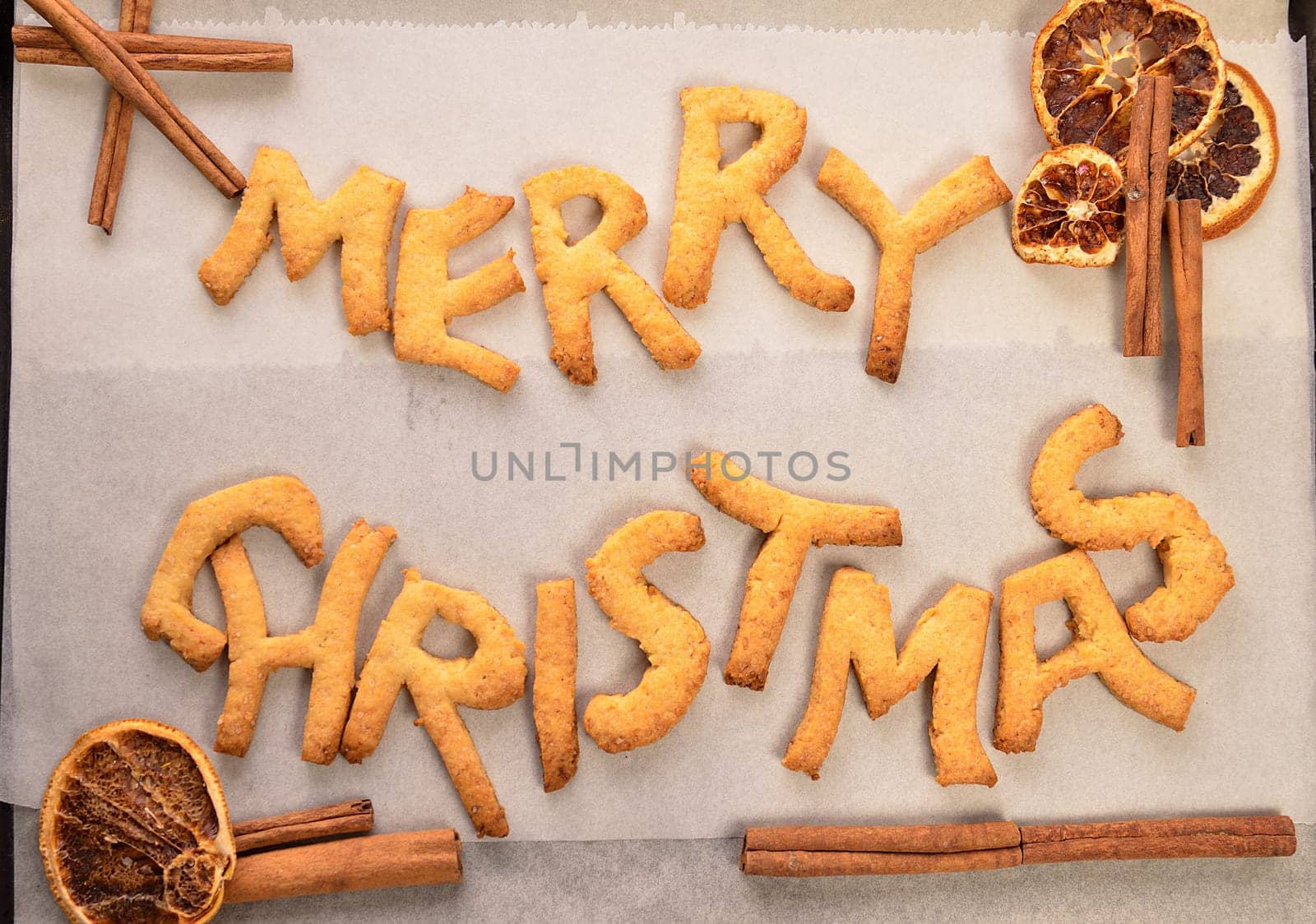 Sweet Christmas cookies with dried fruit slices and cinnamon