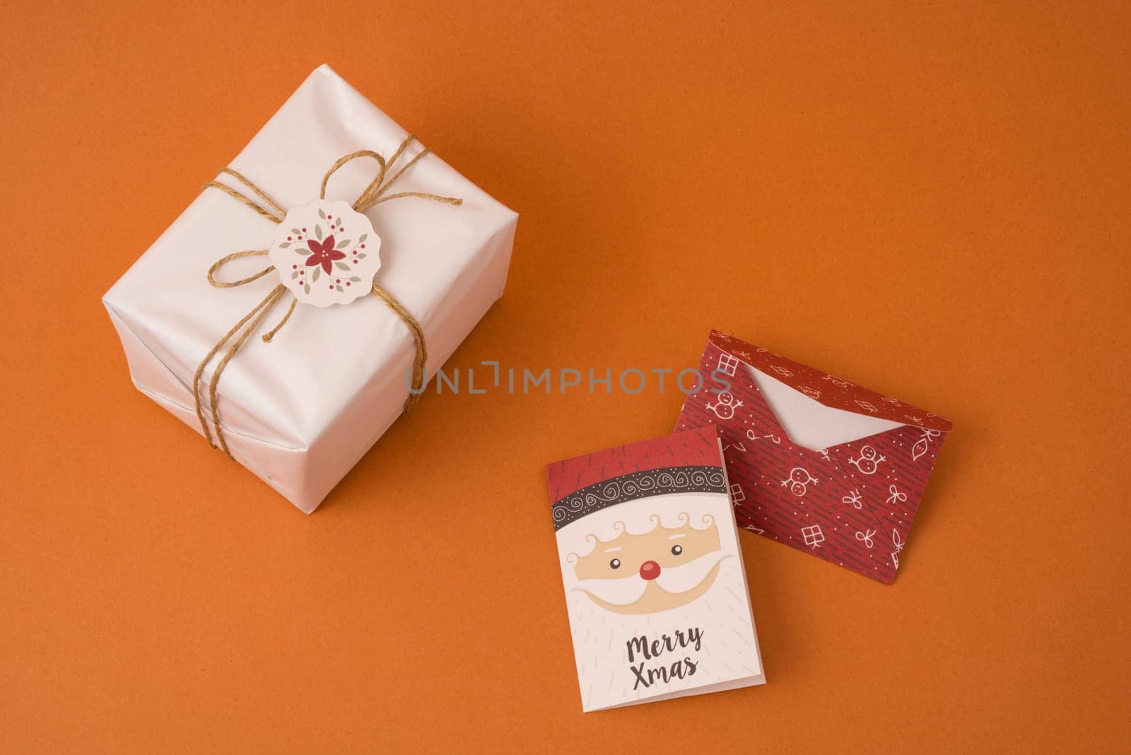 Merry Christmas top view scene composition with rustic vintage gift box, label and holiday greeting card.