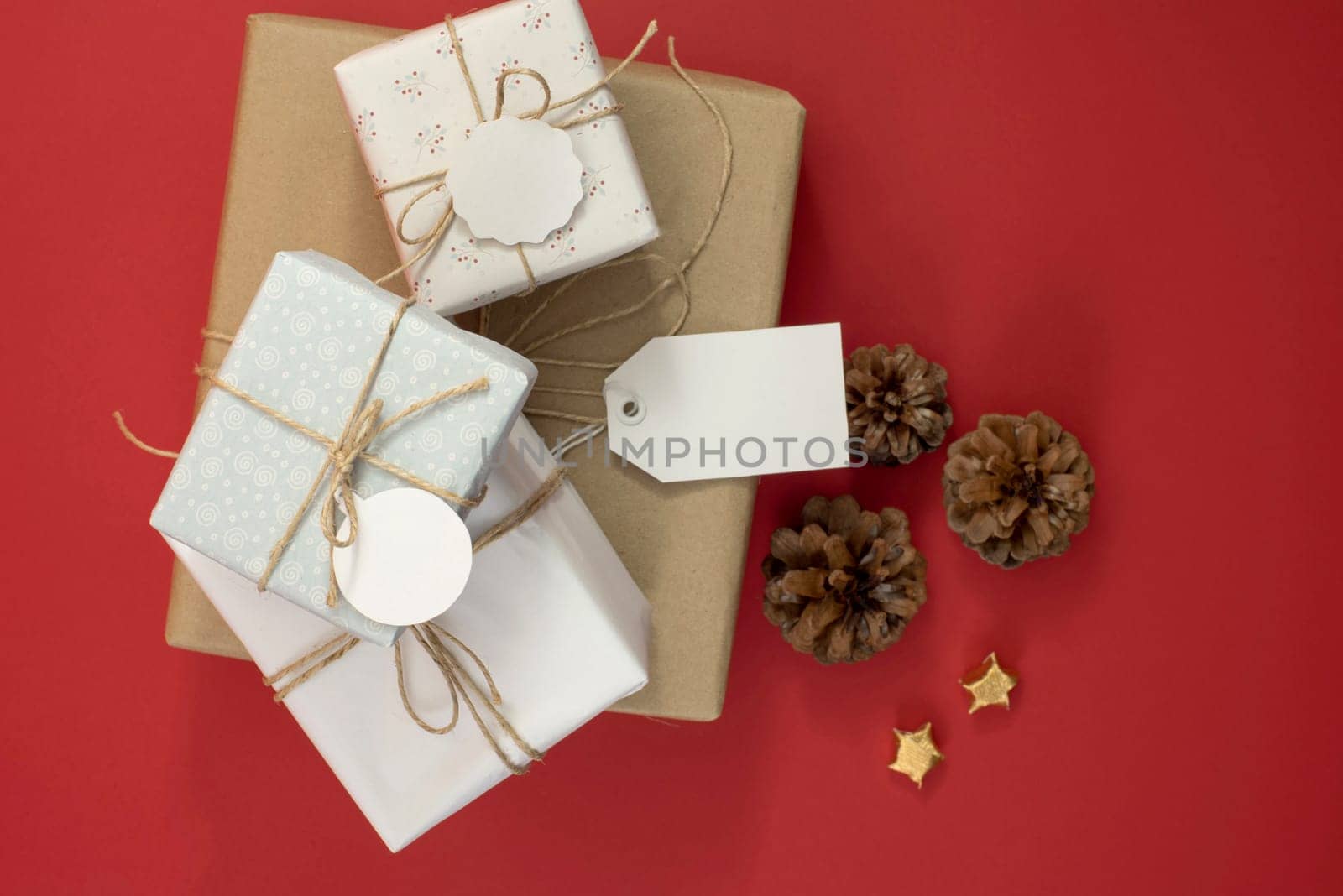 Gift boxes pile for season time template top view with hipster rustic decoration, includes clipping path in empty labels and hang tag. Ideal for design your own business sale, Christmas or birthday.