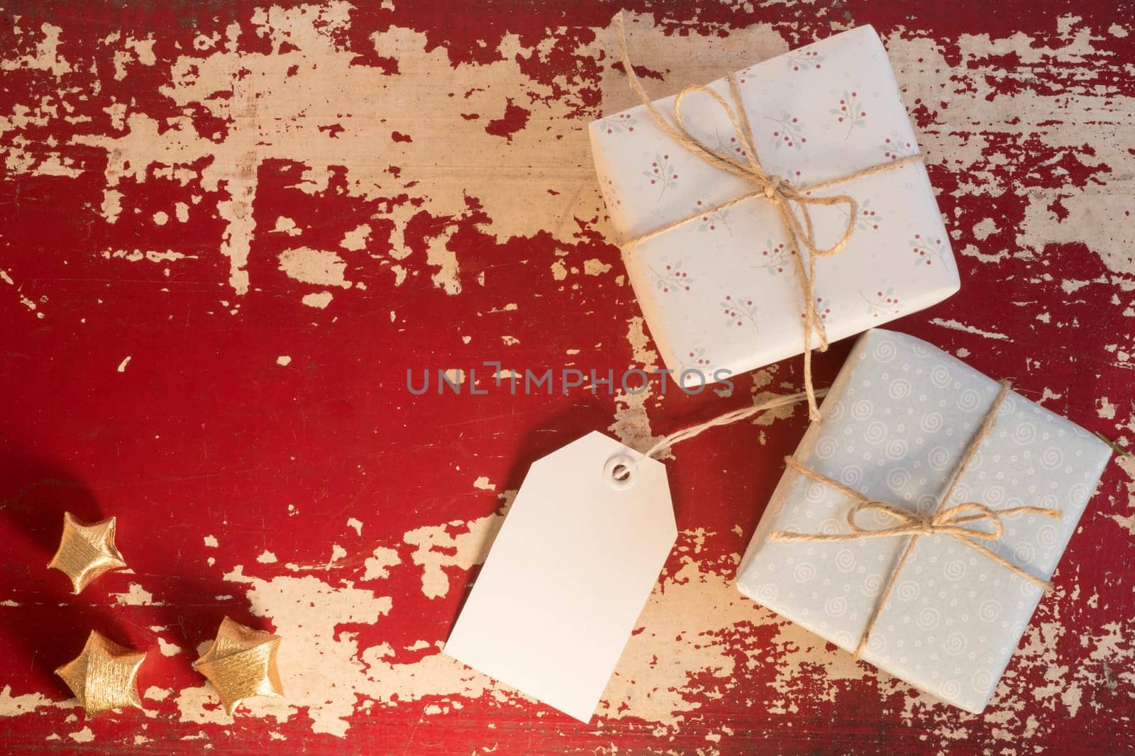 Vintage Holiday concept composition, top view retro gift boxes with empty paper label template and decoration on grunge wood texture background. Includes clipping path.