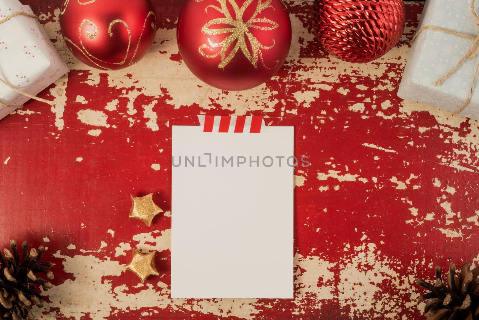 Holiday greeting card top view concept mockup with Christmas decoration and vintage elements on hipster grunge wood background. Includes clipping path.