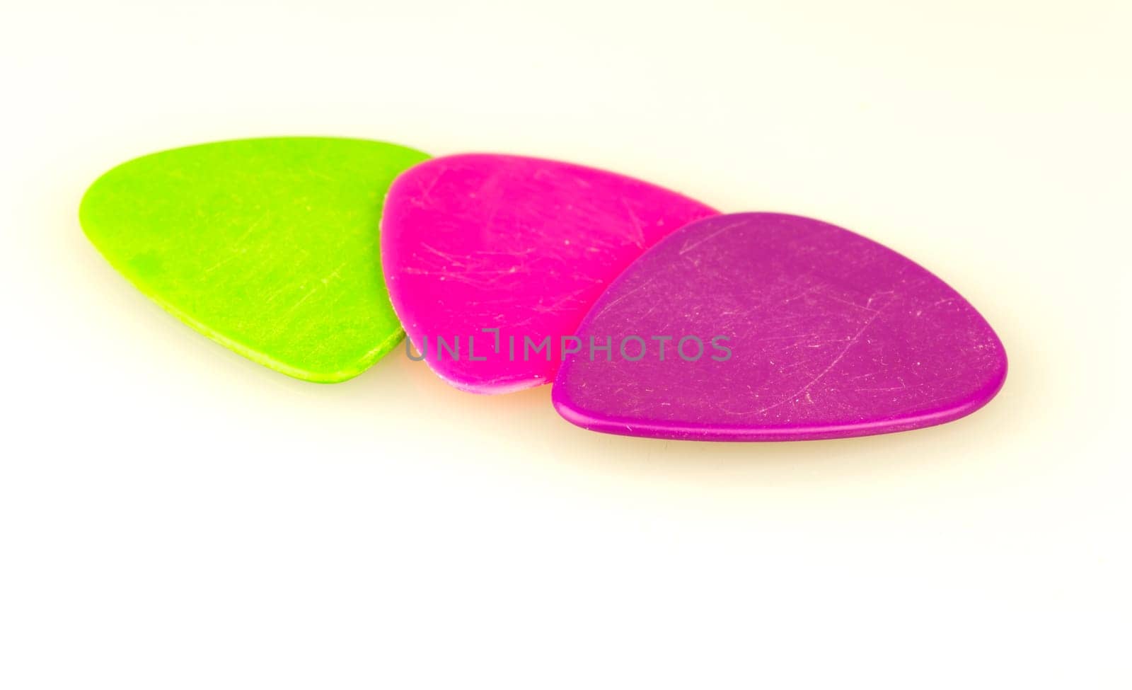 Three Plectrum Close Up on white background.