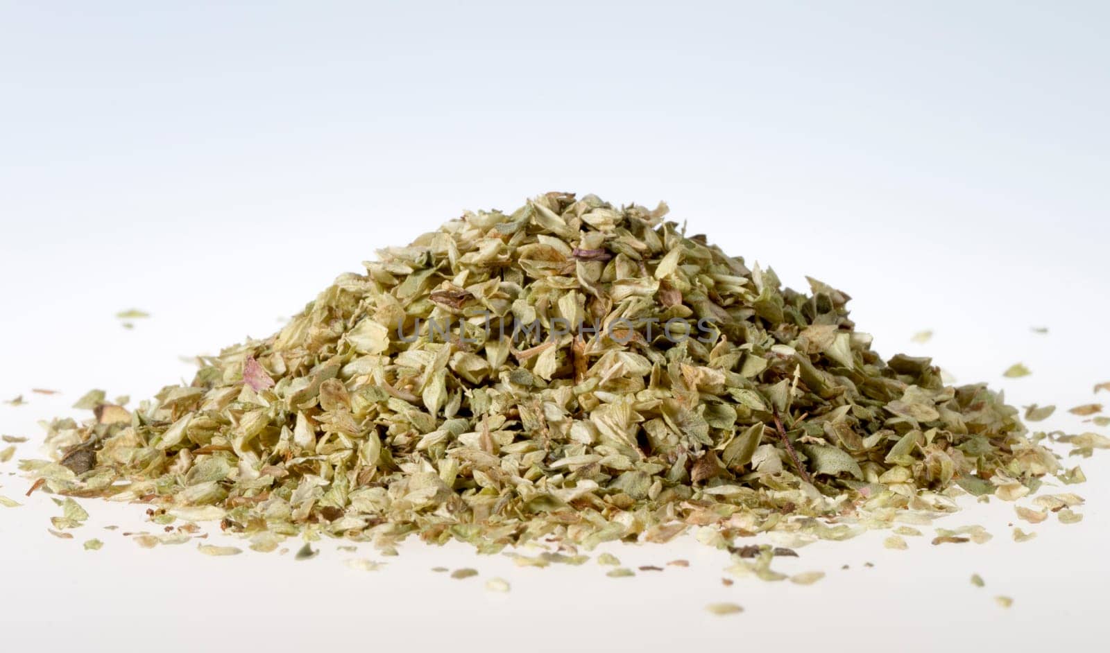 Pile of Dried Oregano with white background. Macro Image.