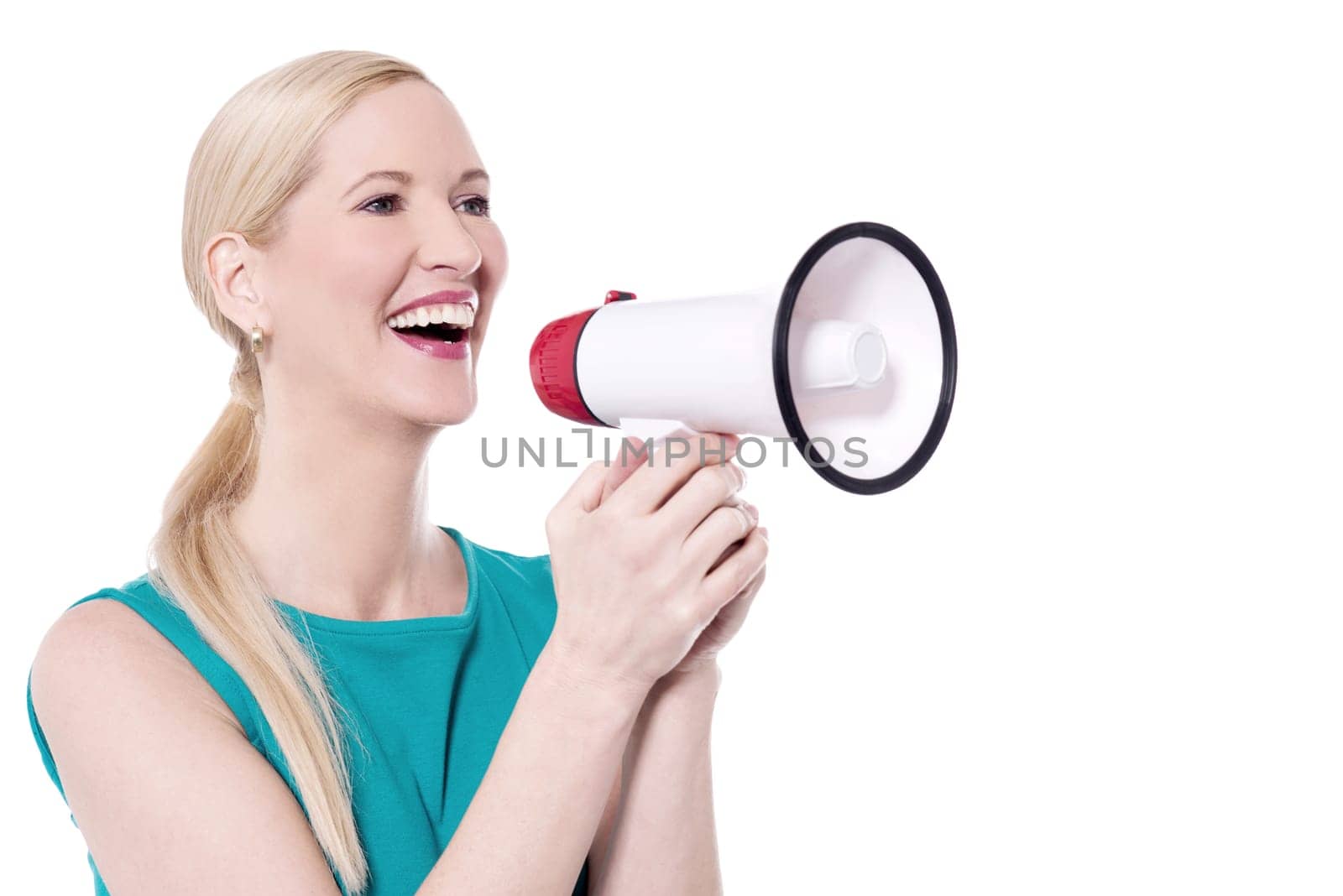 Cheerful woman making announcement with loudhailer