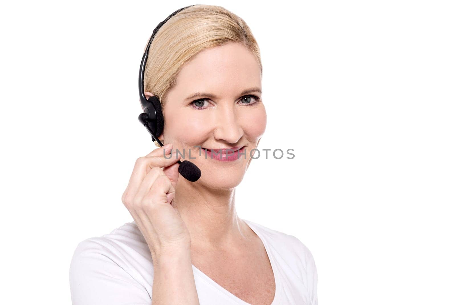 Female executive posing to camera with headset