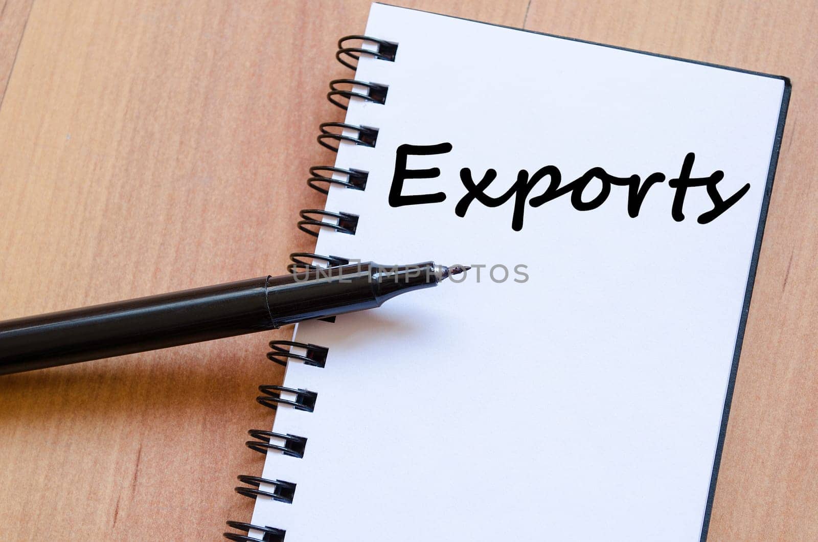 Exports text concept write on notebook with pen
