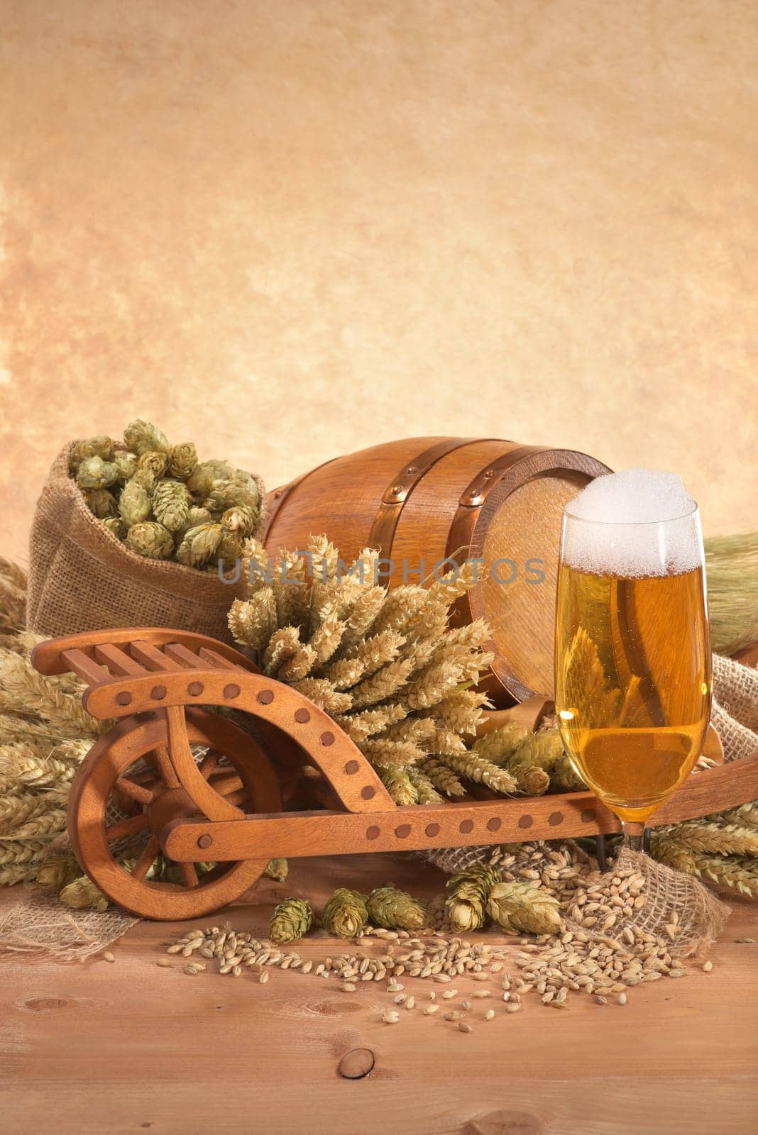 Beer glass with barrel,wheelbarrow,wheat,barley,hops and malt