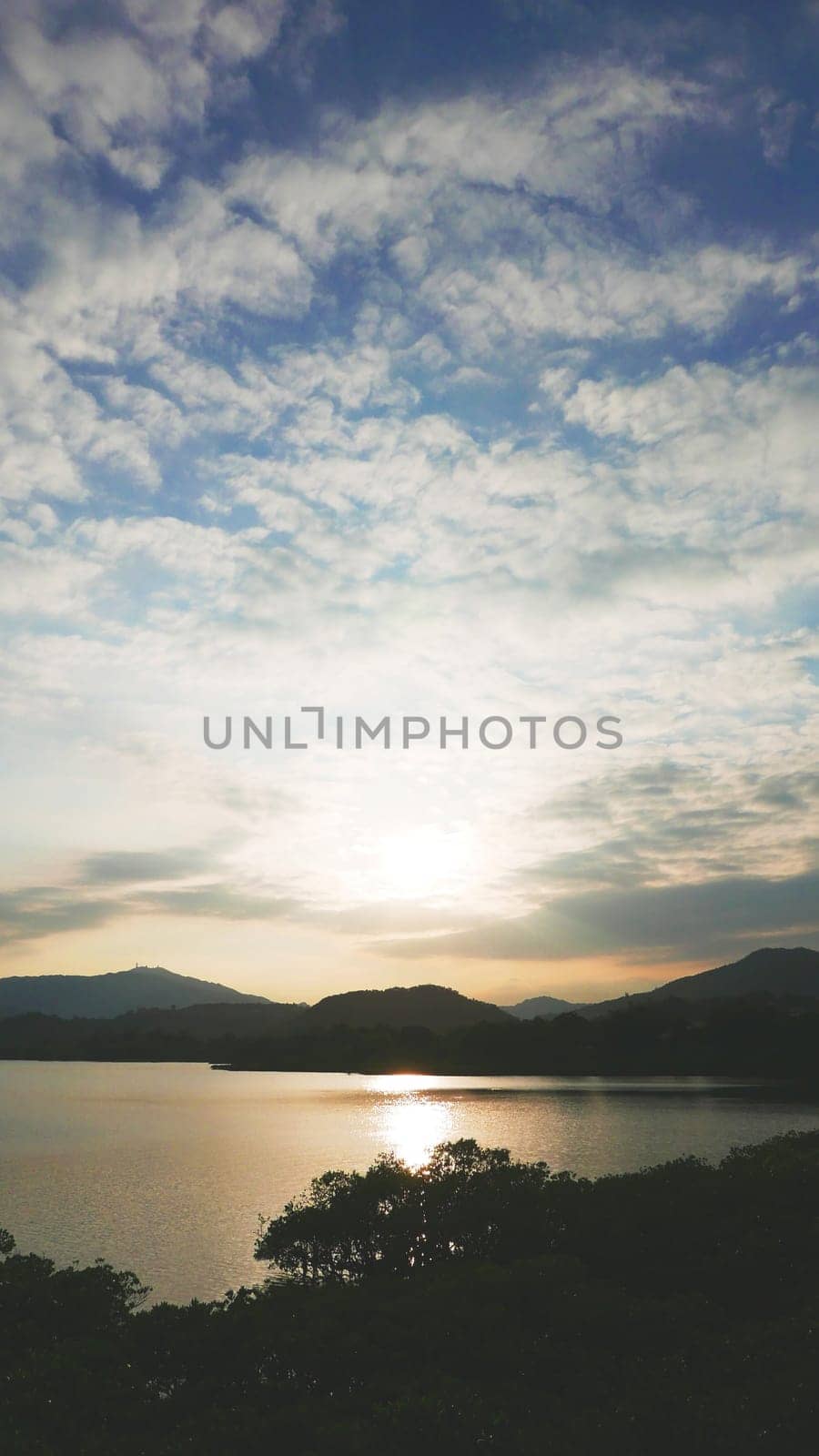 cloudscape and lake landscape photo at sunset