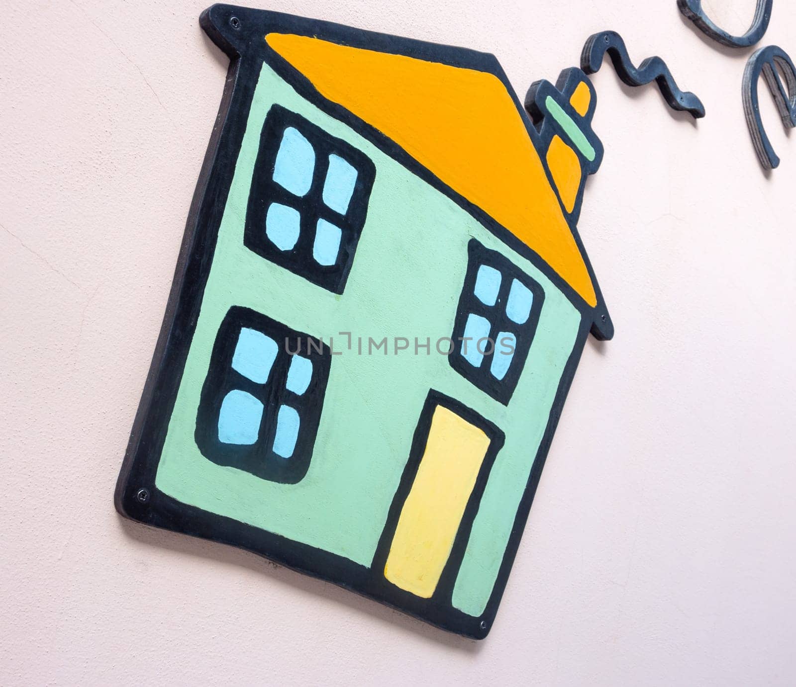 cottage applied on a wall. Small application to the wall of a small house