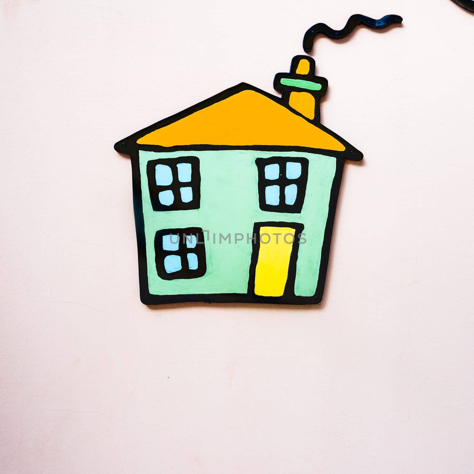 cottage applied on a wall. Small application to the wall of a small house