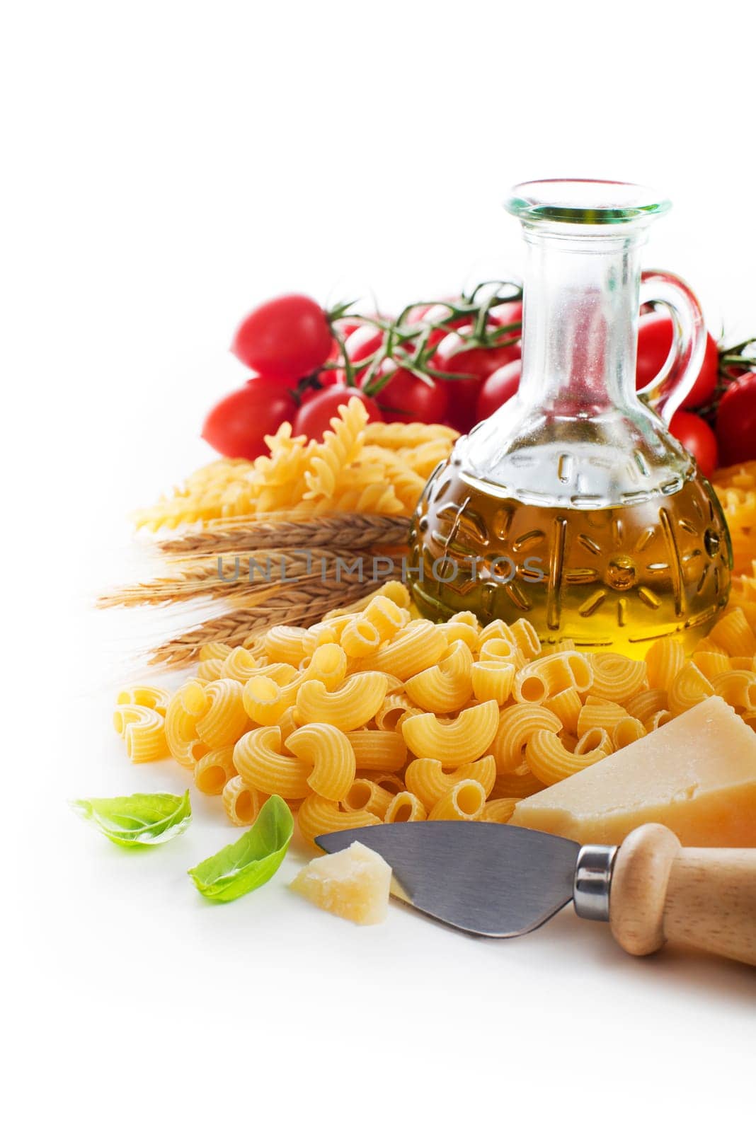 Raw Pasta with ingredients on white background.