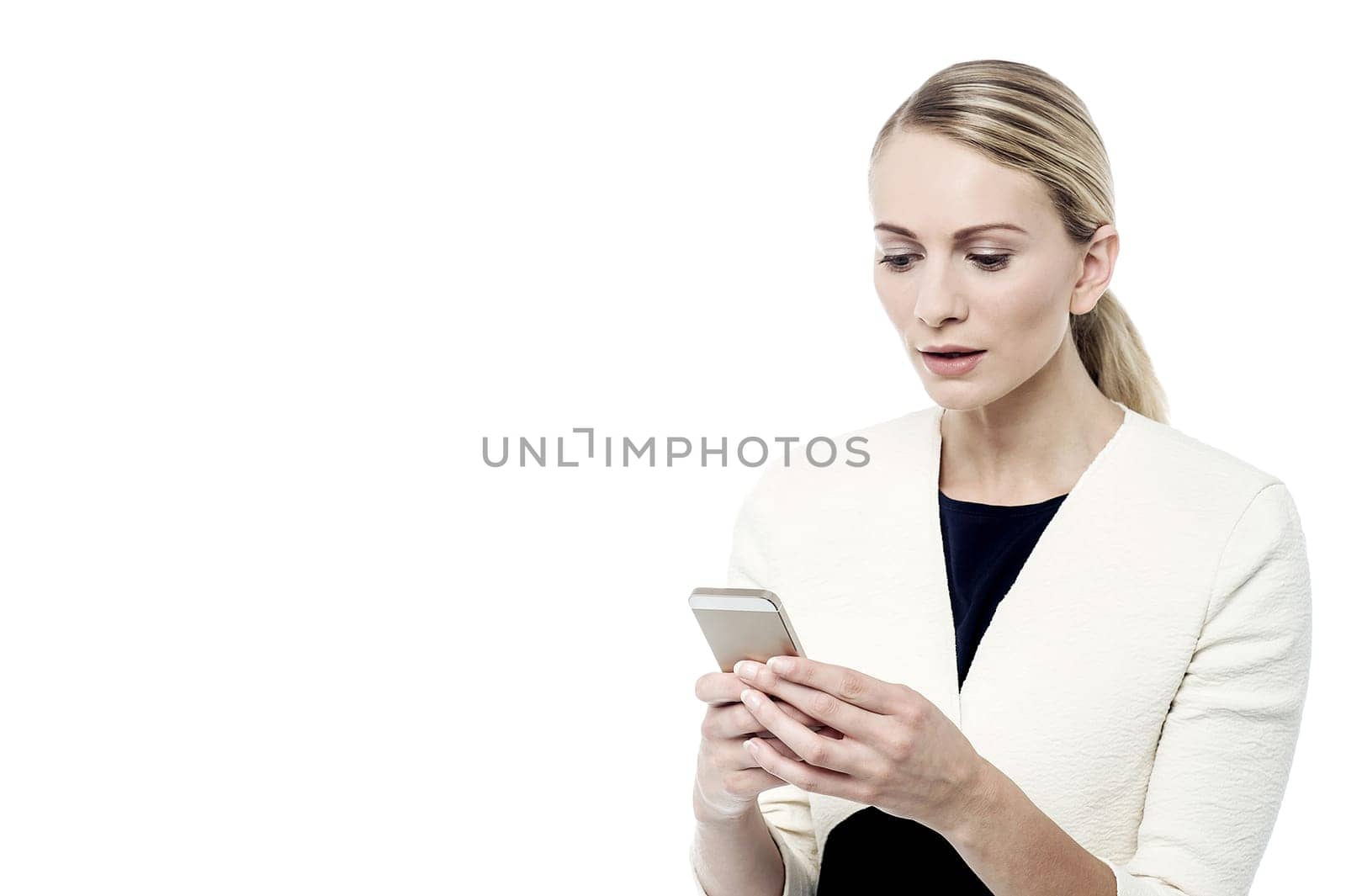 Surprised woman, looking at her mobile phone