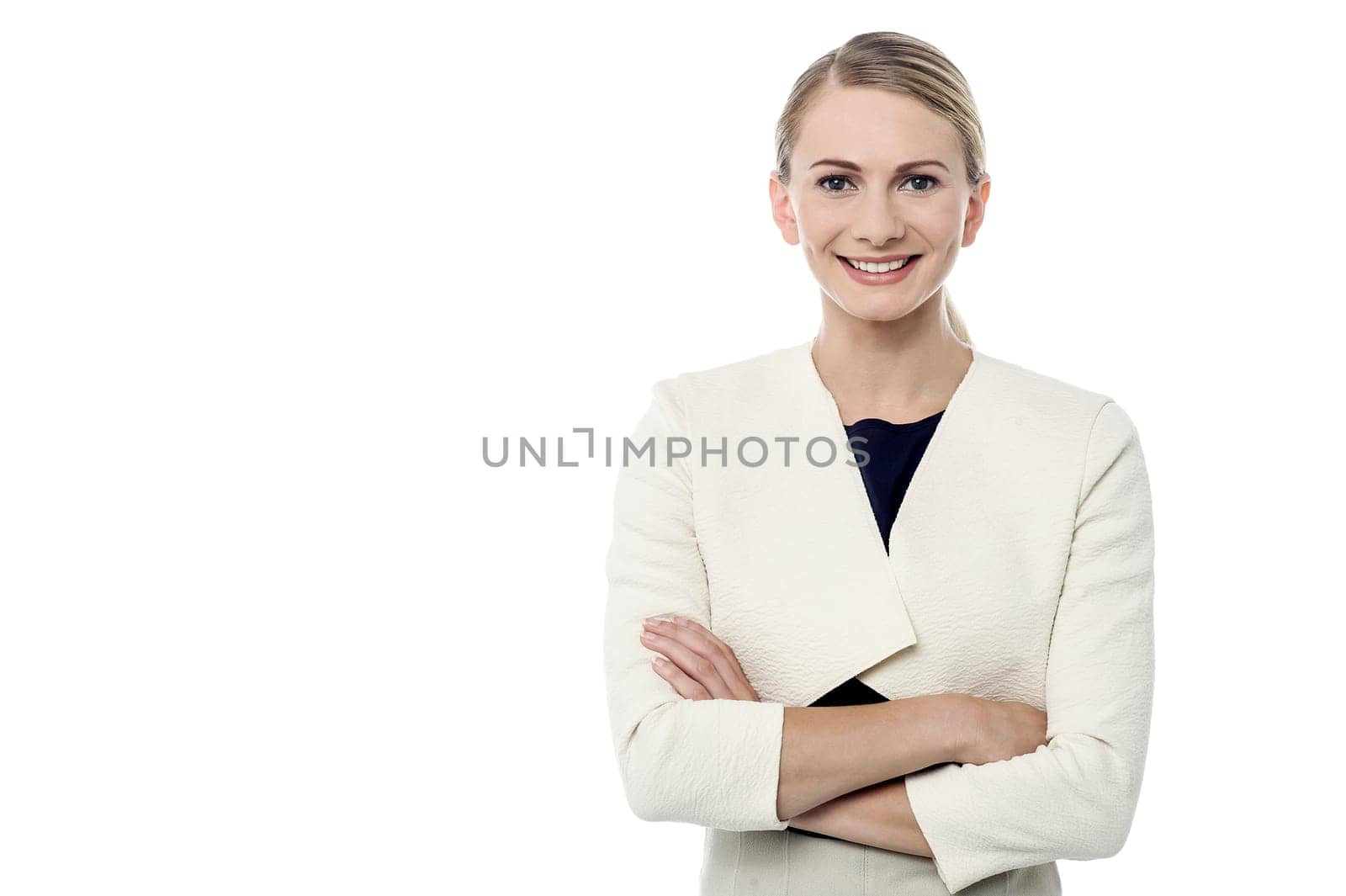 Young woman with folded arms looking into camera