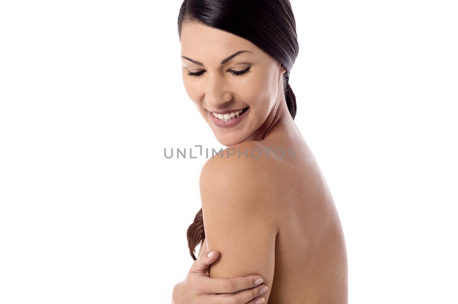 Topless pretty woman posing over white background