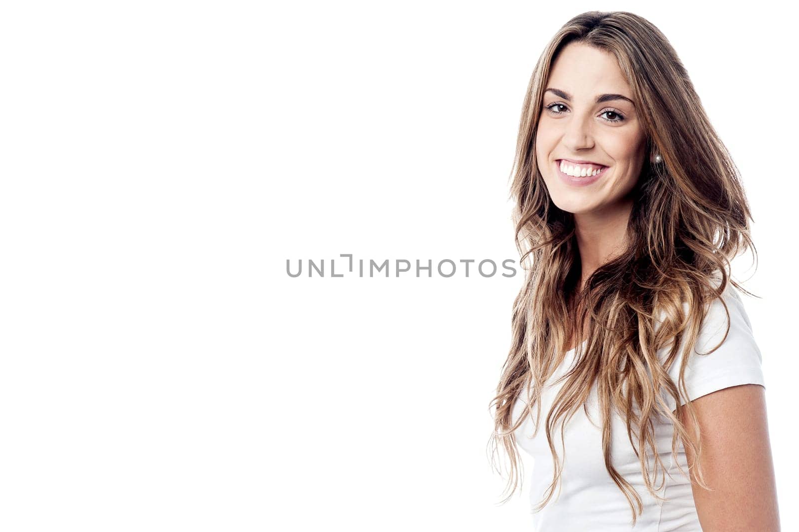Beautiful young girl posing to camera sideways