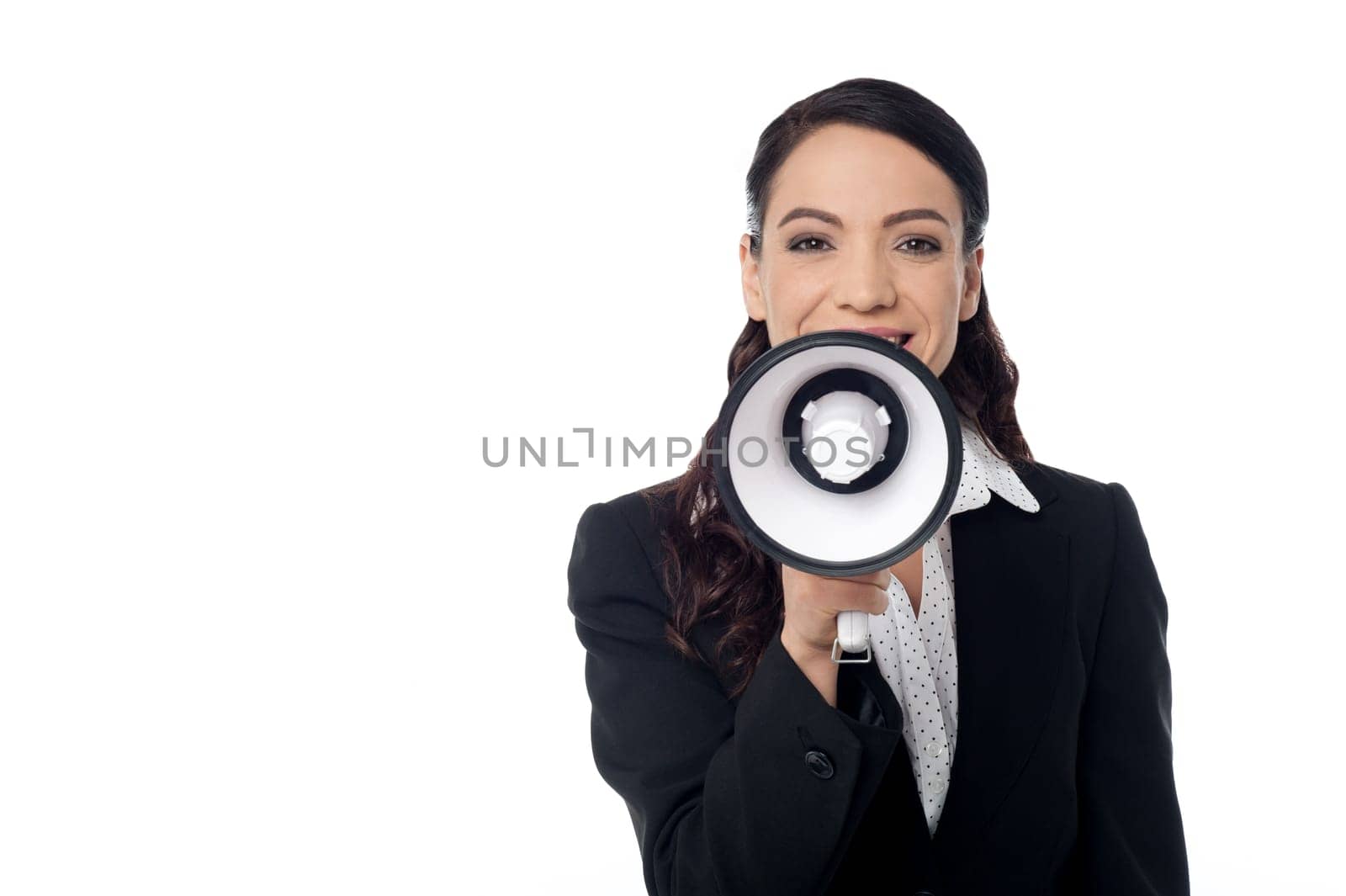 Corporate woman making announcement with loudhailer over white