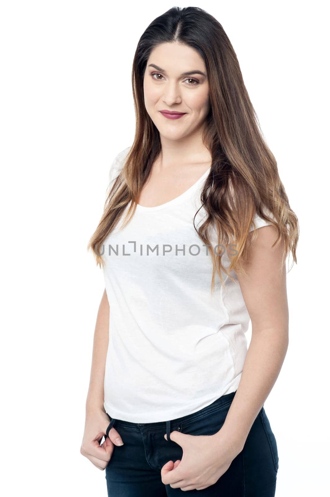 Pretty young woman posing stylishly over white