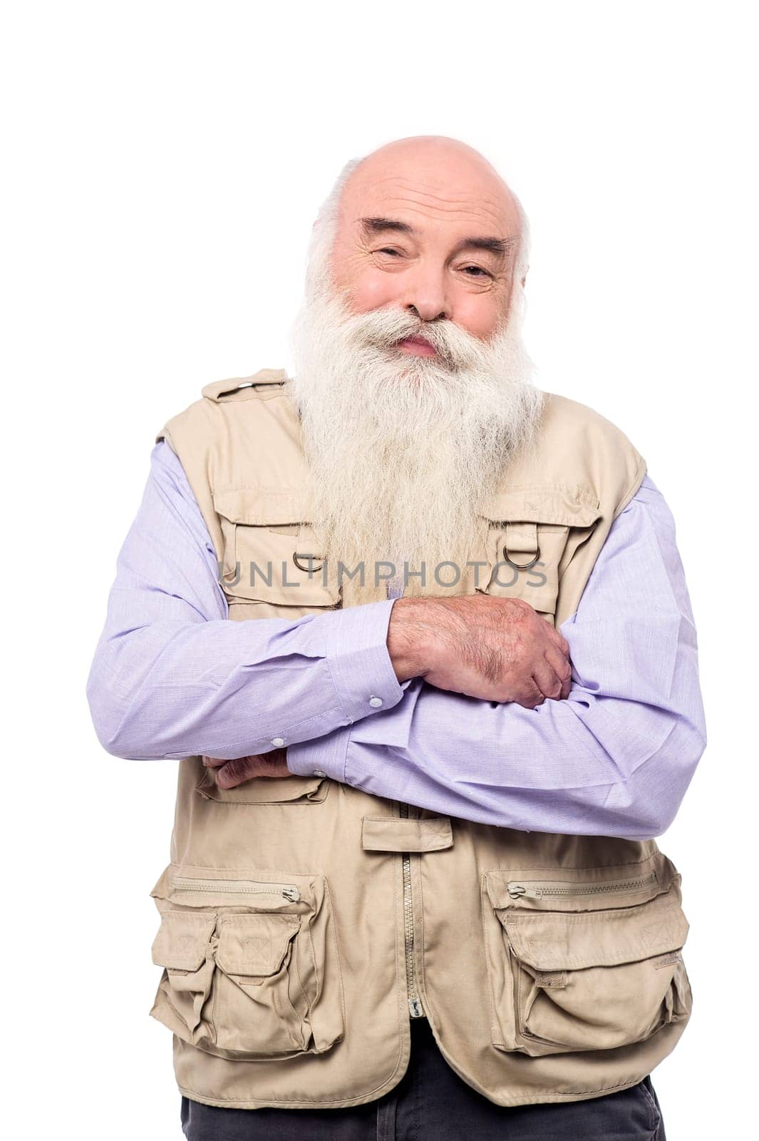 Senior man with crossed arms posing to camera