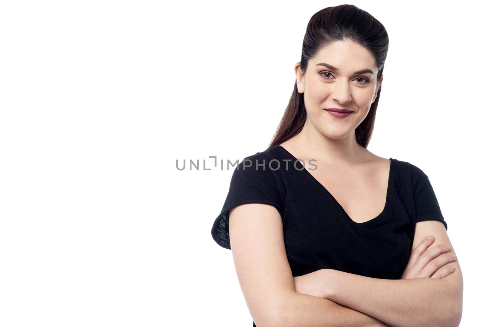 Young female posing with folded arms over white