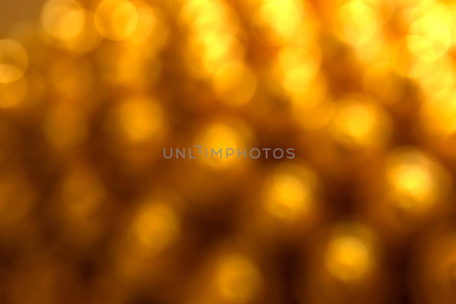 Abstract circular natural gold light bokeh background