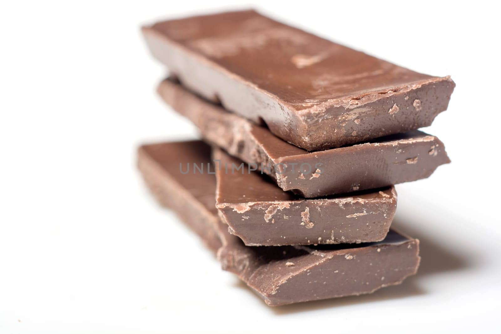 Parts of dark chocolate on the table